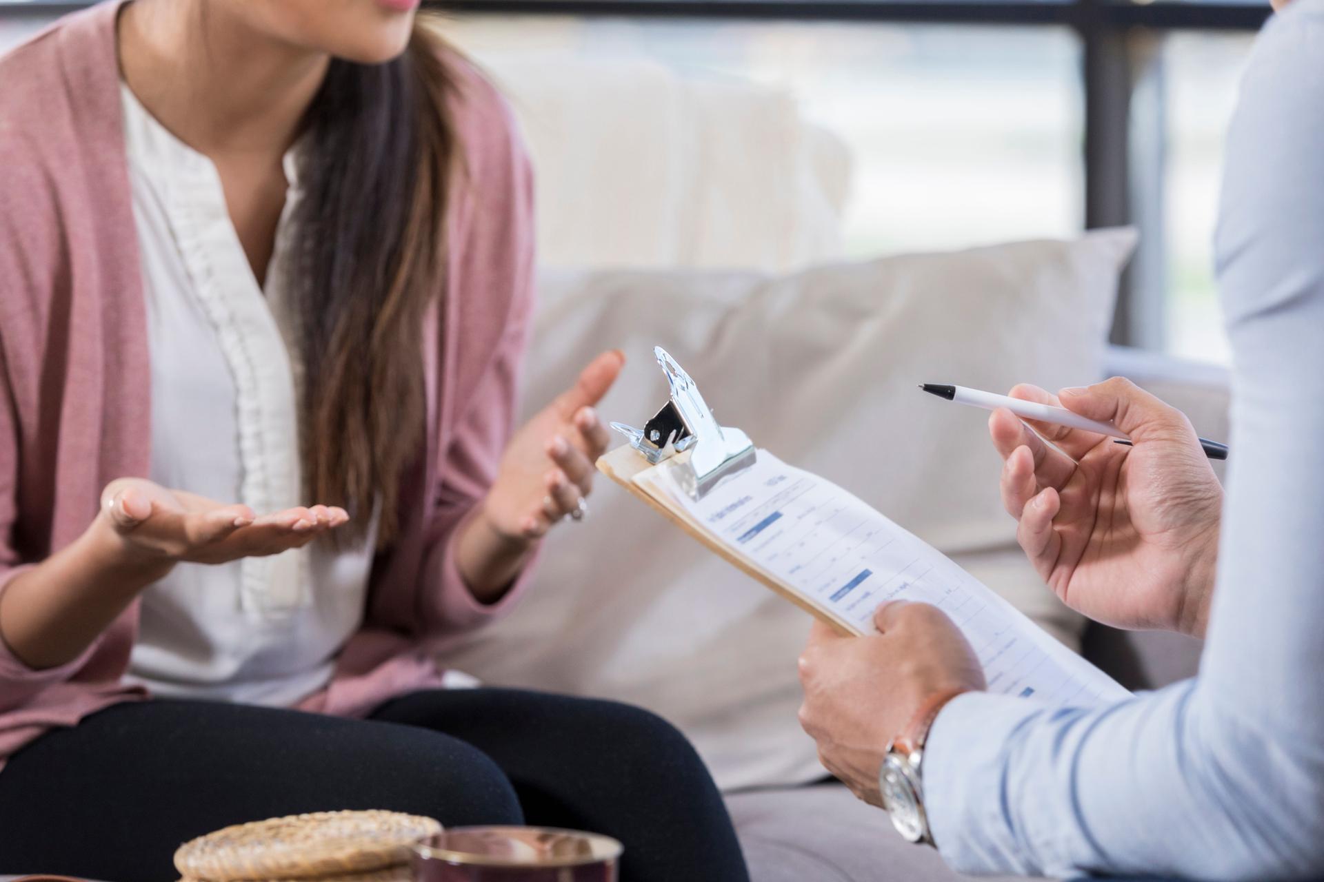 Female counseling patient talks with counselor