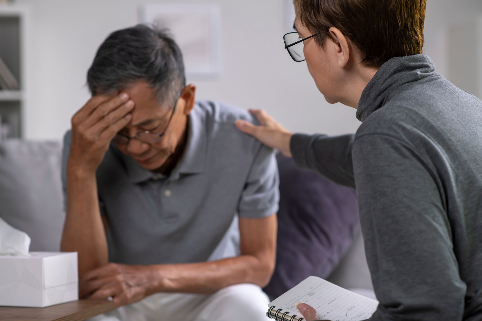 Senior patient with mental health problem talking and consulting therapist